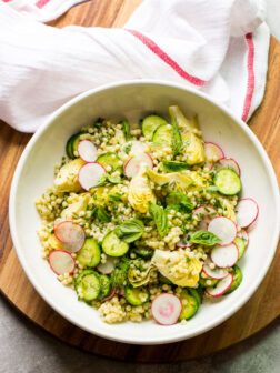Overhead pearl couscous salad with spring vegetables