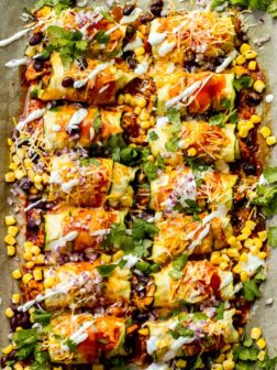 Overhead zucchini chicken enchiladas in sheet pan