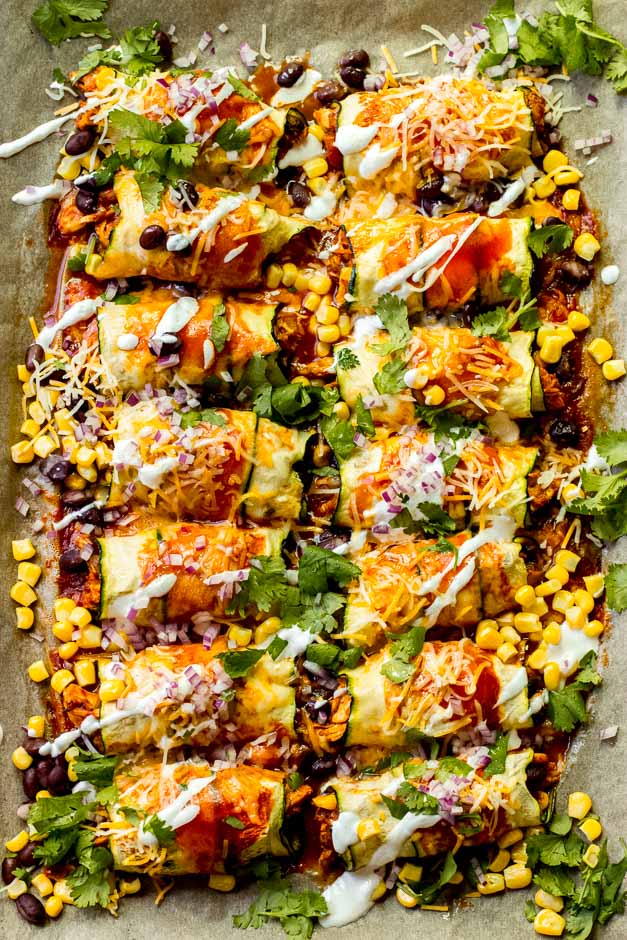 Overhead zucchini chicken enchiladas in sheet pan