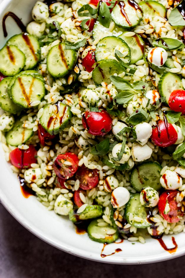 Close up orzo salad in white bowl