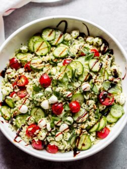 Pasta salad with orzo in white bowl