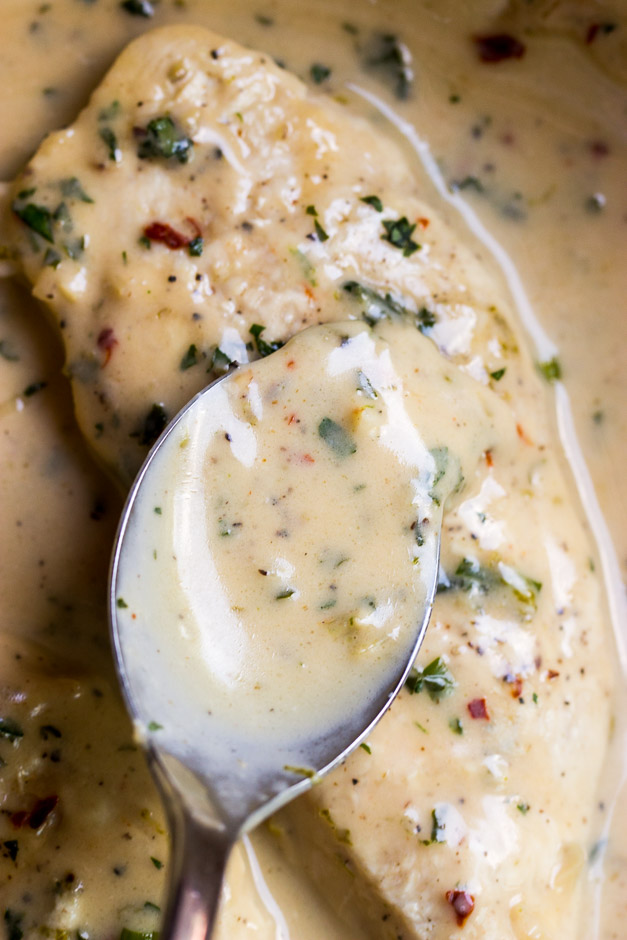 Close up of coconut lime sauce over chicken