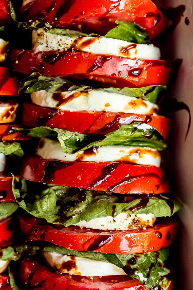 Close up tomato mozzarella salad with balsamic reduction