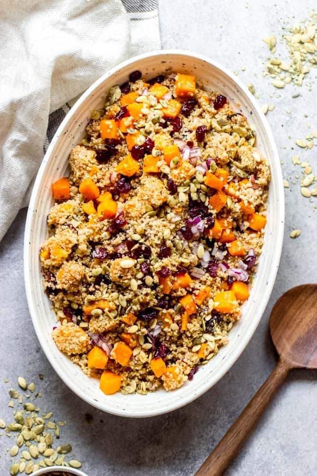 butternut squash quinoa salad in oval white bowl.