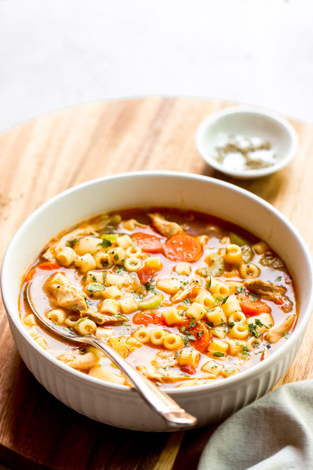 italian chicken soup in white bowl