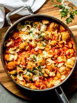 chicken meatballs with pasta in skillet