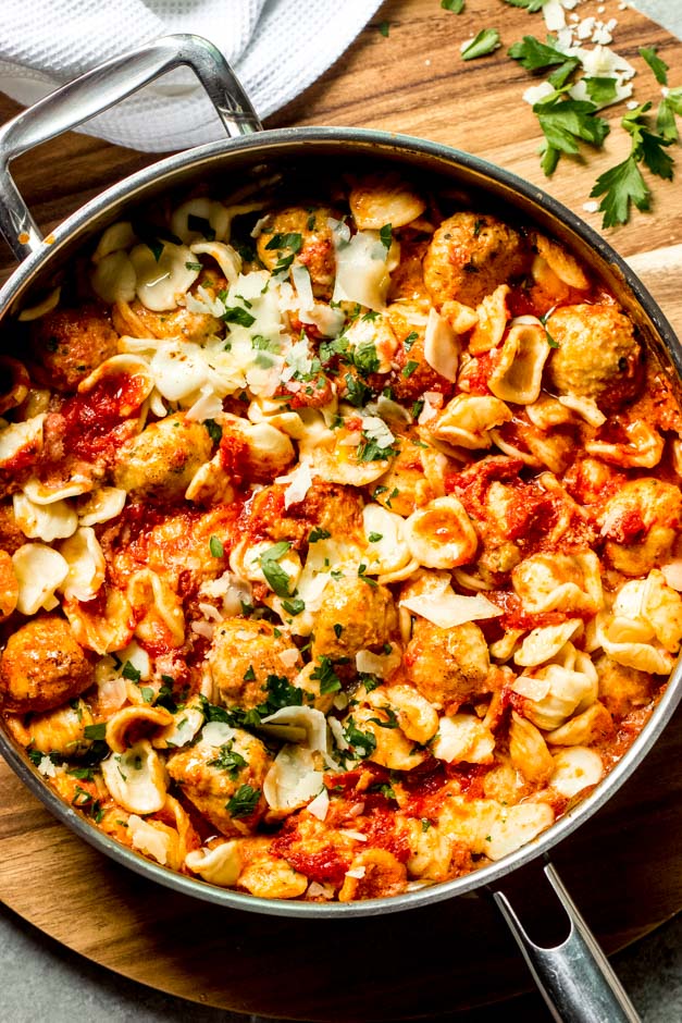 close up chicken meatball pasta in tomato cream sauce