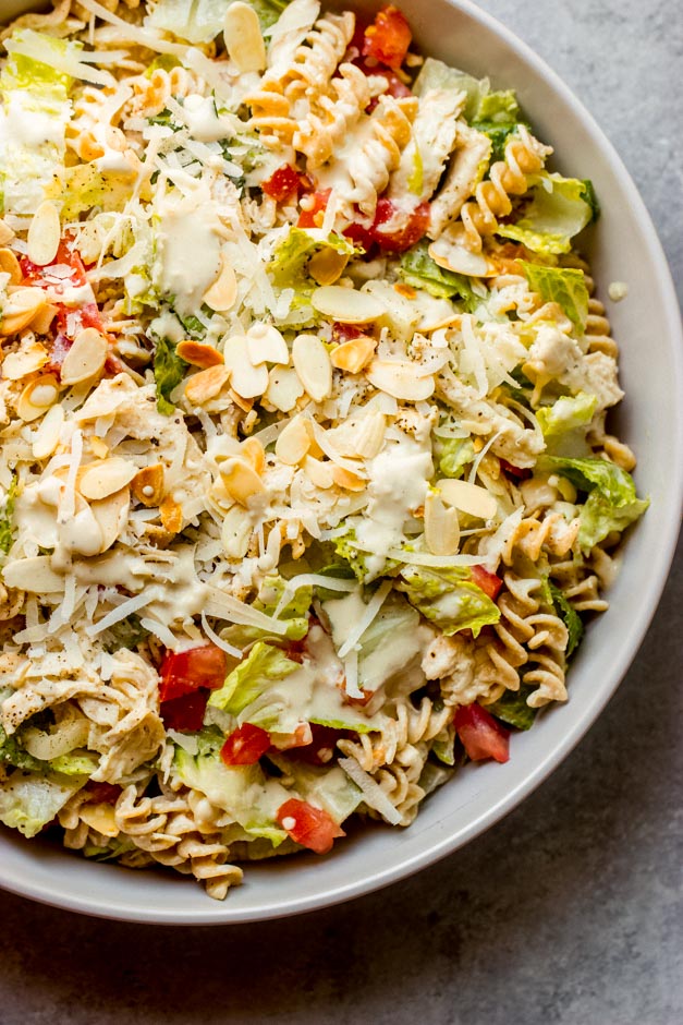 close up caesar pasta salad with chicken.