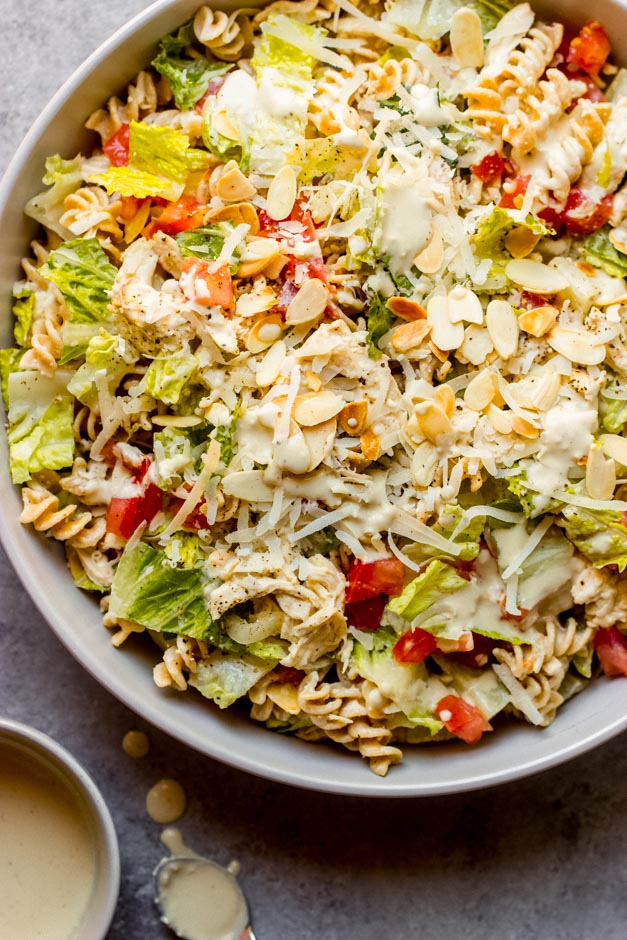 close up caesar pasta salad in grey bowl.