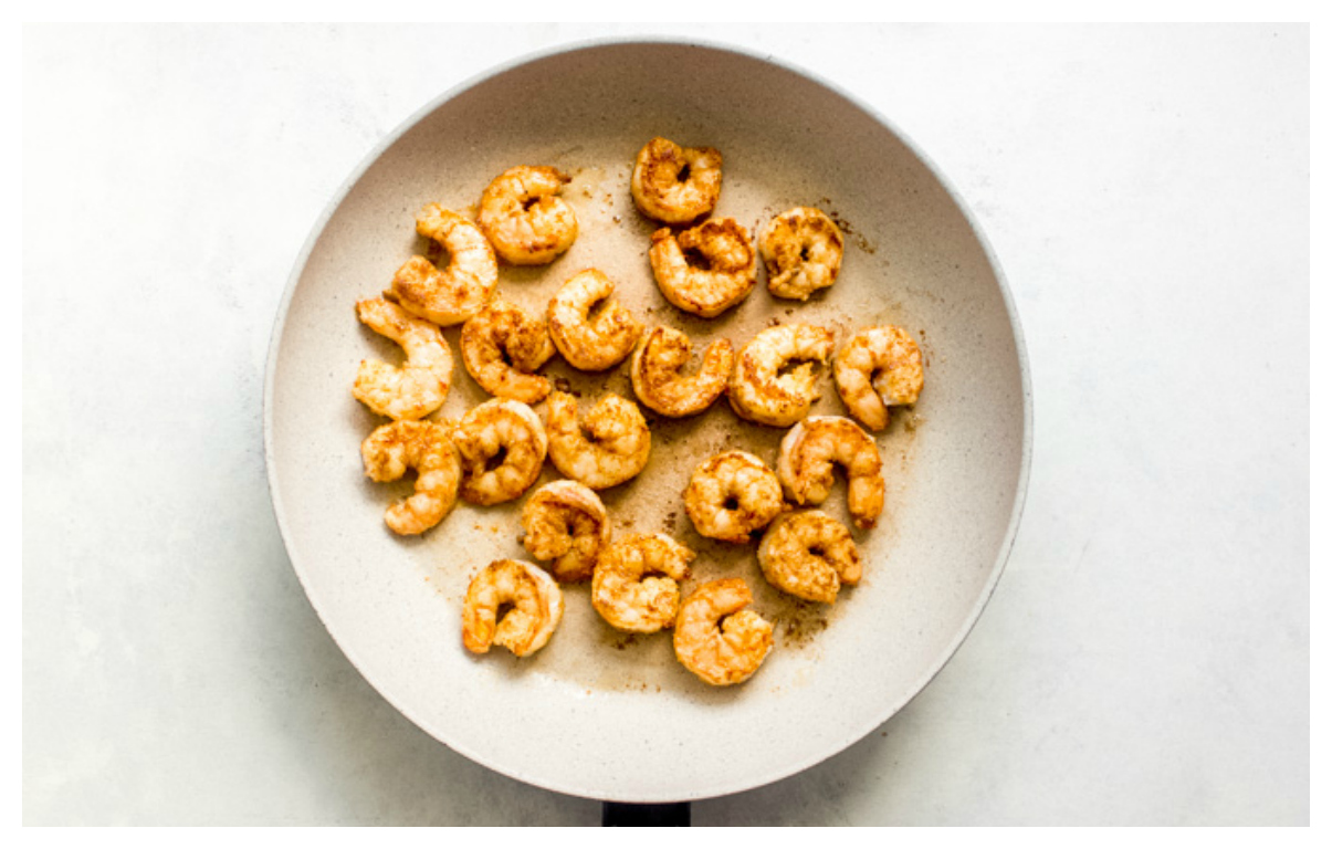 cooked spicy shrimp in a skillet