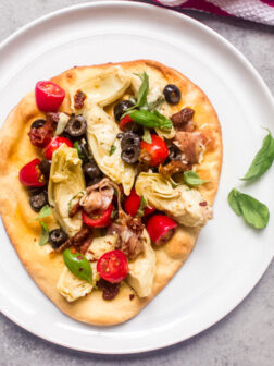 close up mediterranean flatbread on a plate