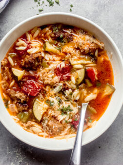 overhead of zucchini sausage soup recipe in a bowl