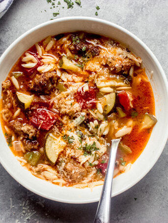 overhead of zucchini sausage soup recipe in a bowl