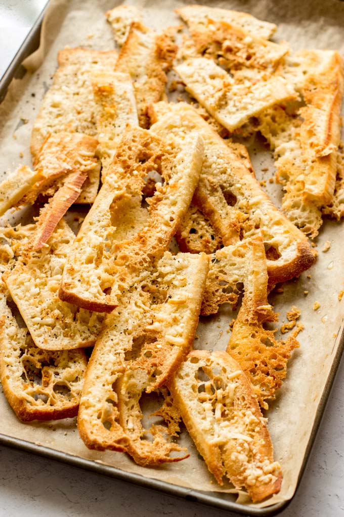 parmesan cheese crisps on a baking pan.