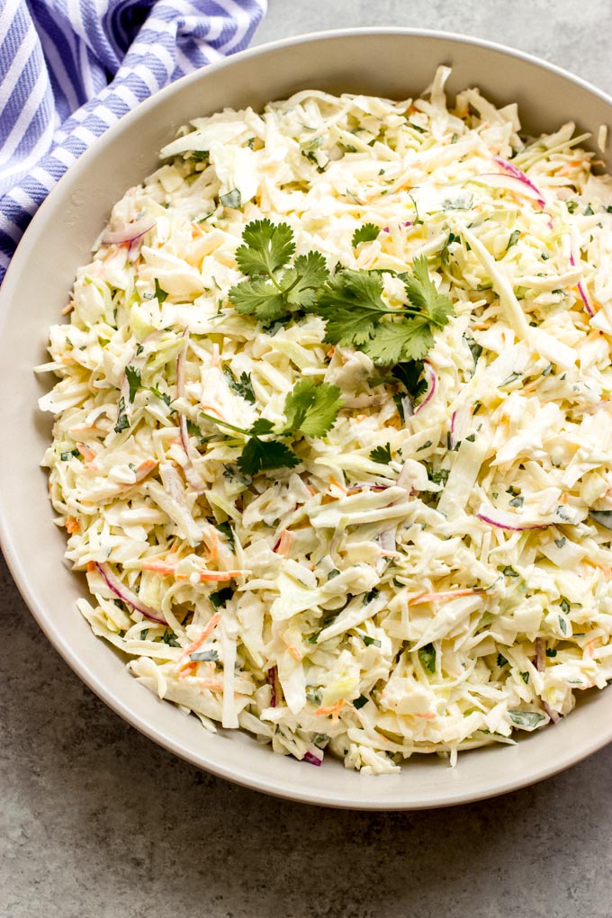 close up easy coleslaw recipe in white bowl