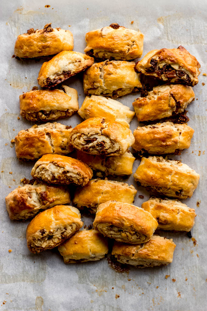 fig cookies layered on a white surface.