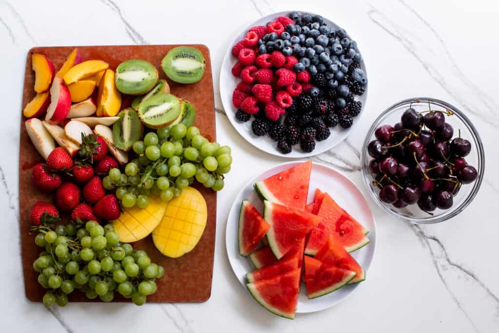 cut up fresh fruit on a plates.