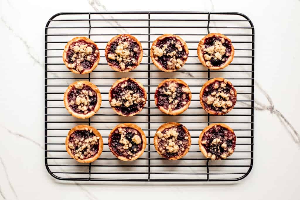 baked cherry pies on a cooling rack