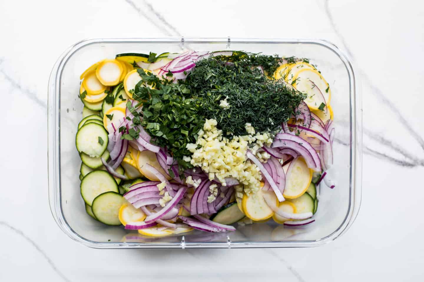 sliced squash in a tupperware