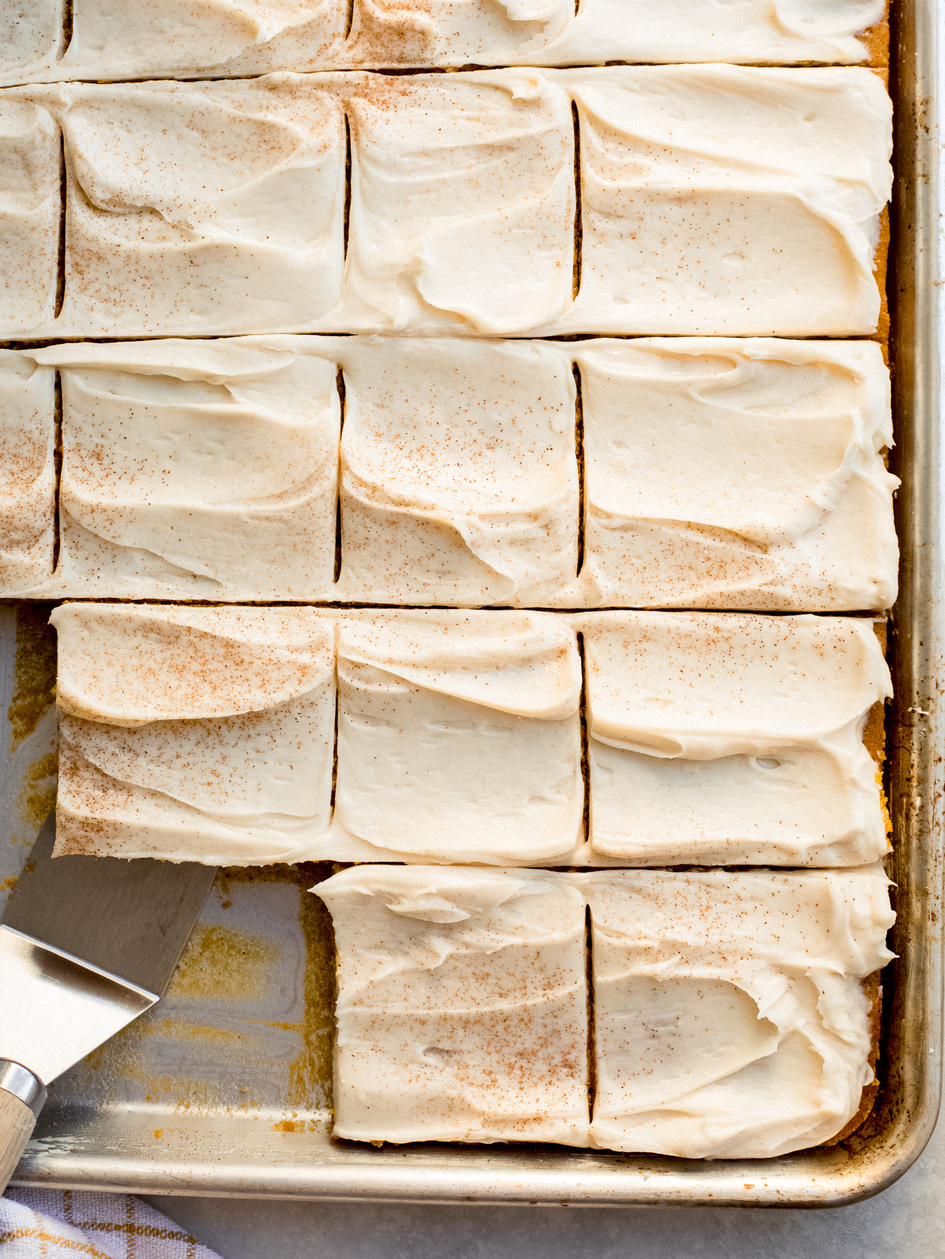 pumpkin sheet cake cut into bars.