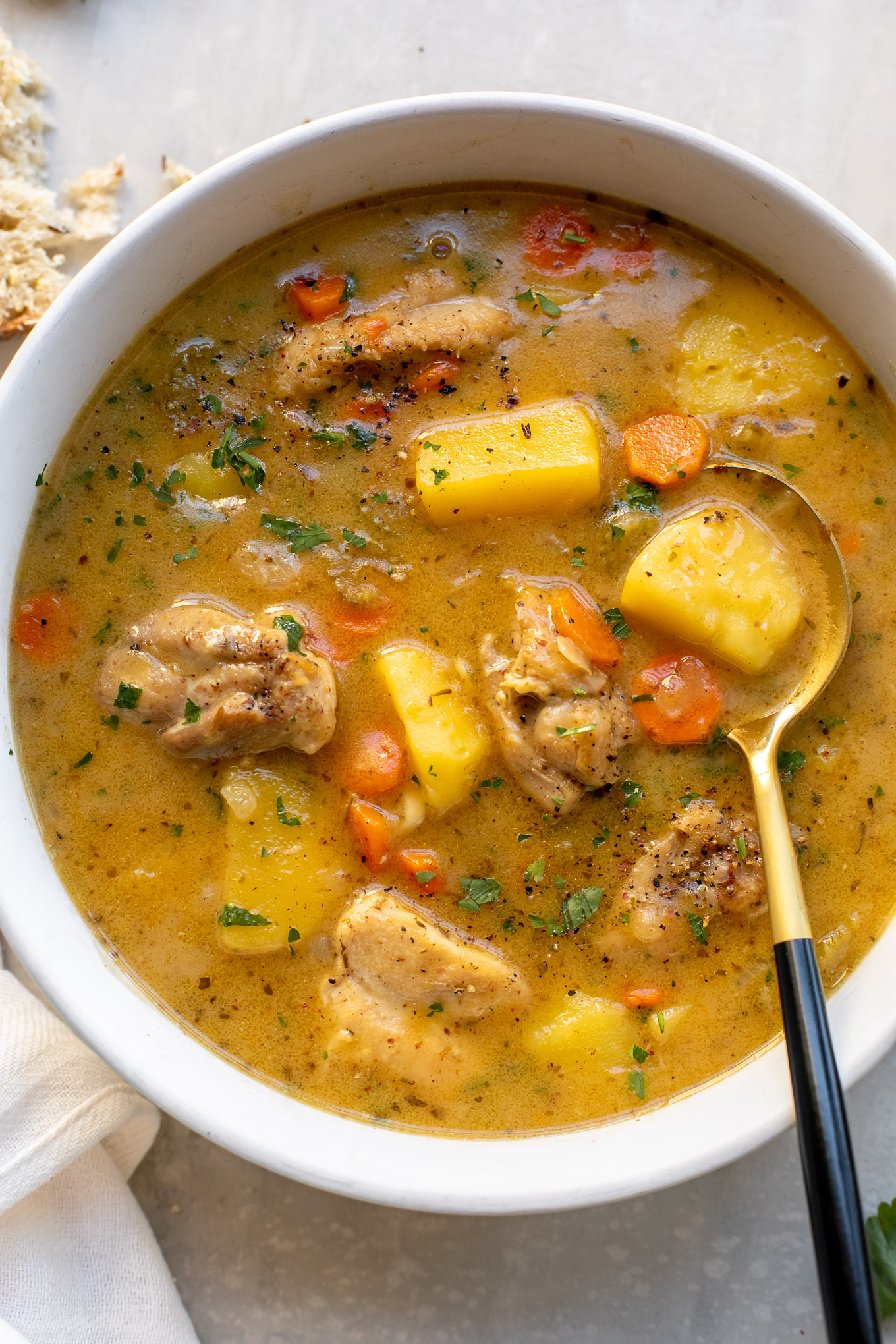 creamy chicken stew in a bowl.