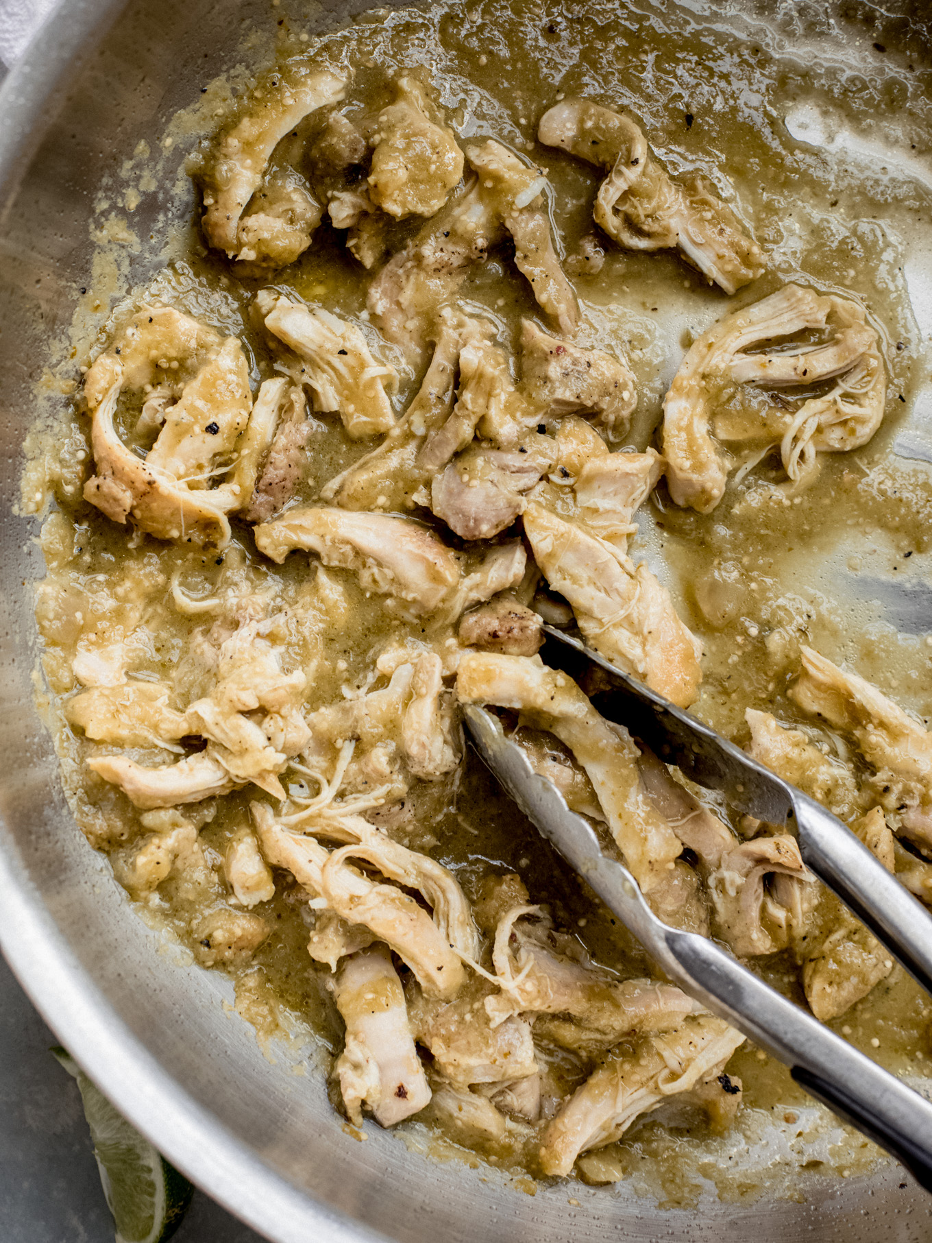 shredded chicken in a pan.