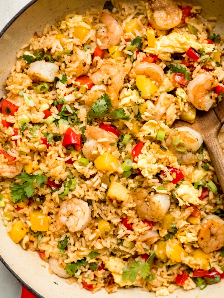 close up fried rice with shrimp in a skillet.