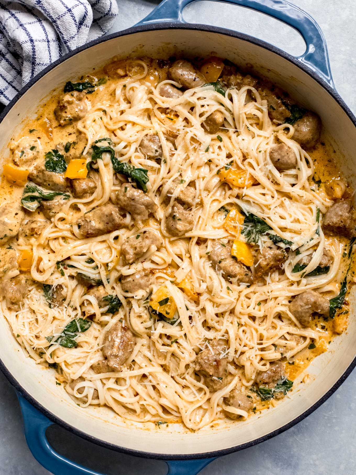 cajun pasta with sausage in a saute pan.