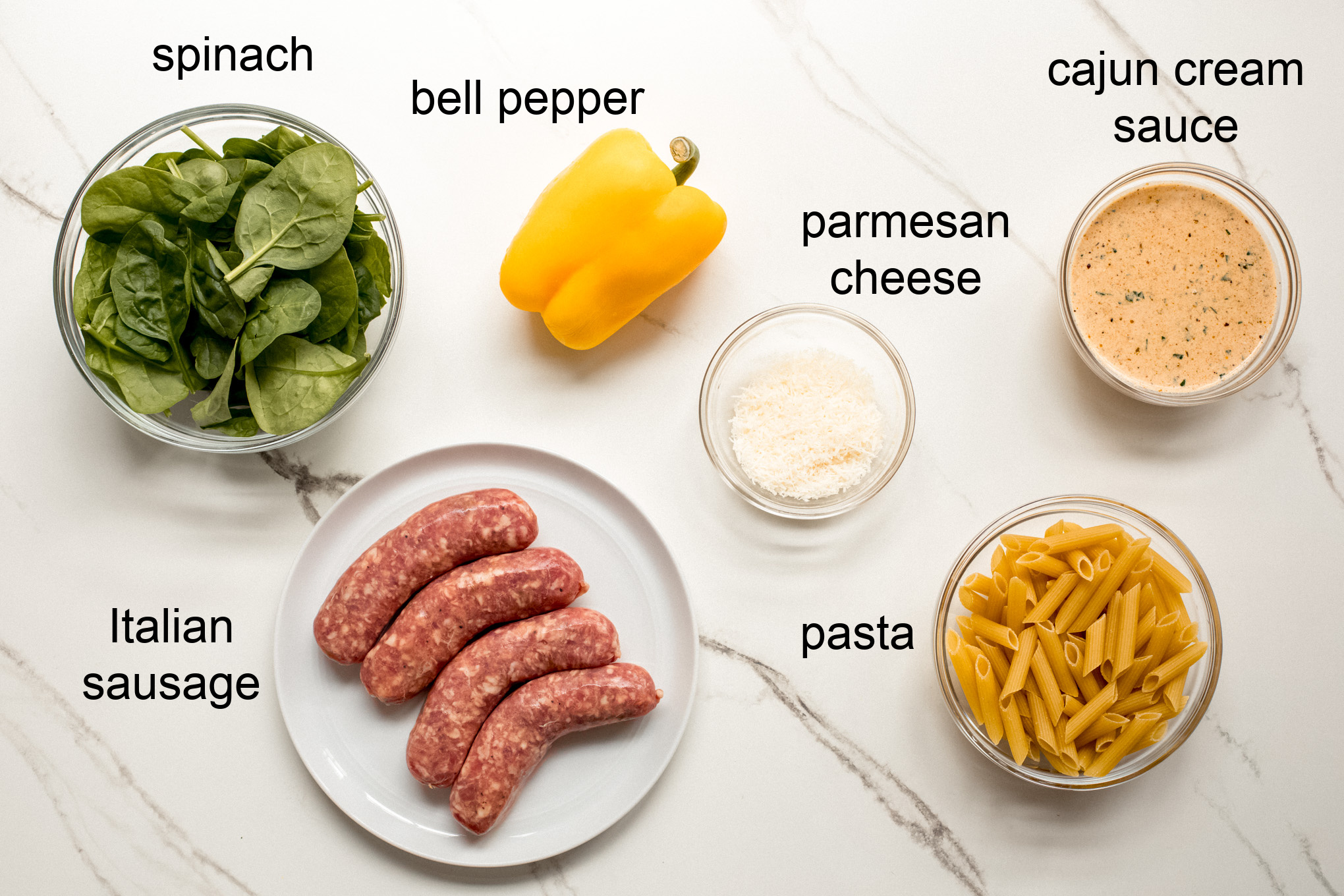 ingredients for creamy cajun sausage pasta.
