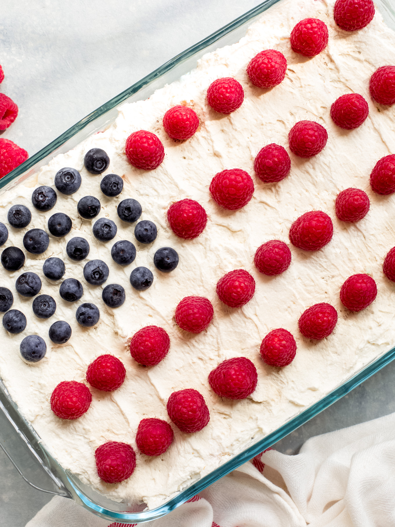 icebox cake in a glass dish decorated as American flag.