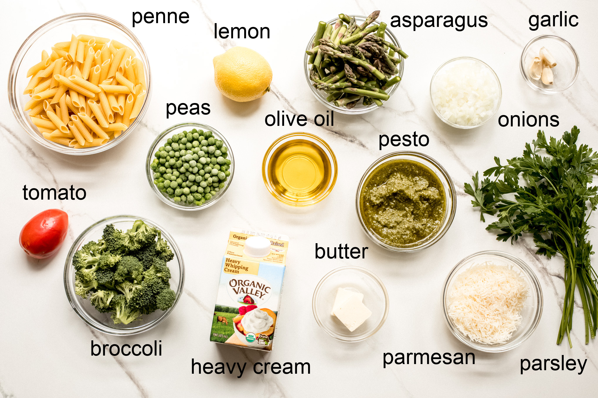 overhead photo of ingredients needed to make penne pasta primavera.
