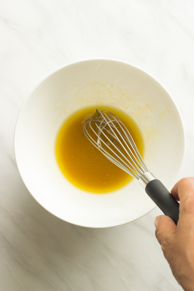 dijon and olive oil salad vinaigrette in a bowl.