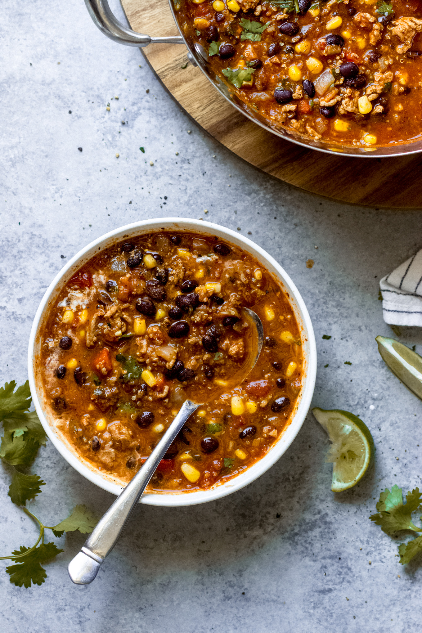 turkey chili in a bowl with a spoon in it.