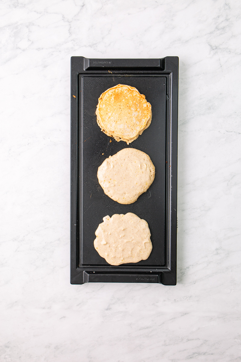pancakes on a griddle.