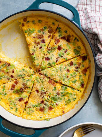 sliced egg casserole in a cast iron.