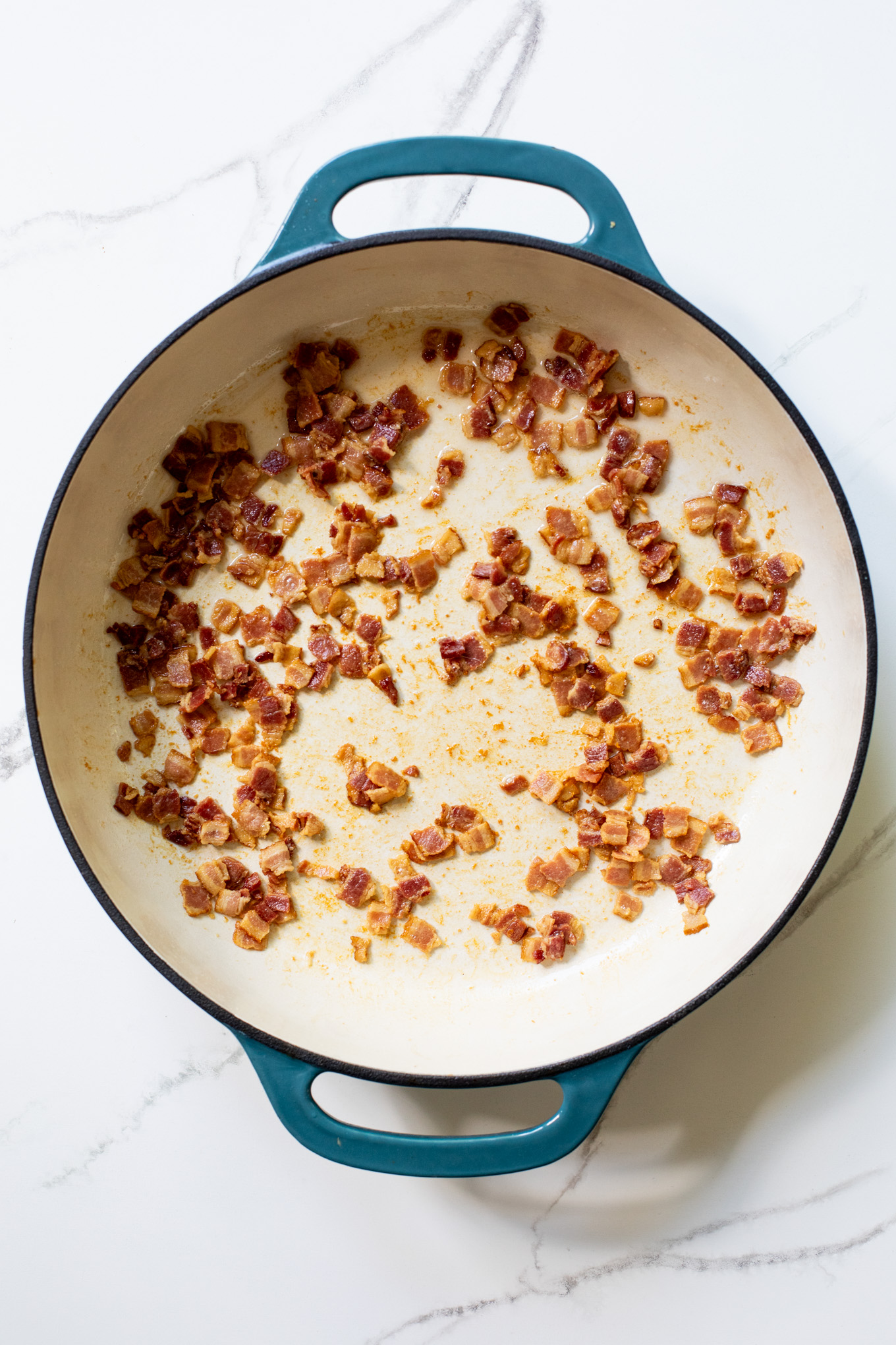 cooked bacon in a cast-iron skillet.