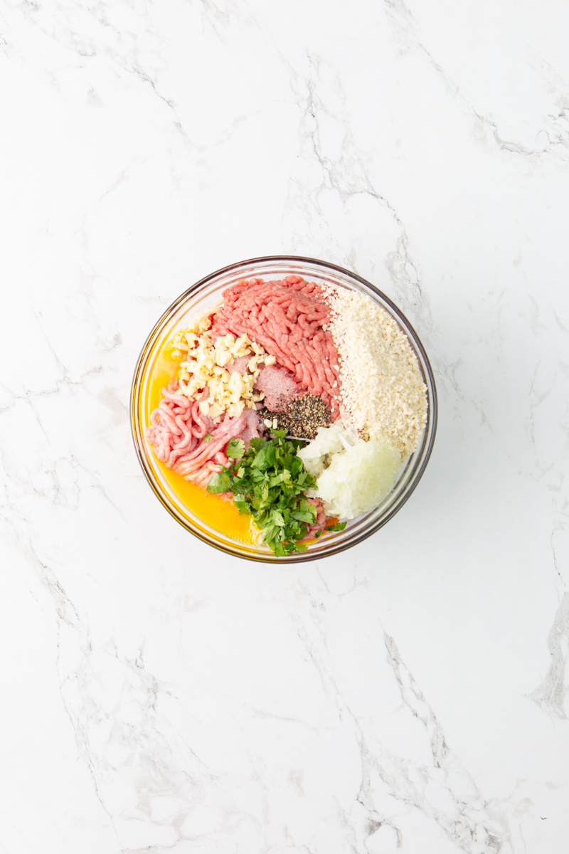 meatballs mixture in a glass bowl.