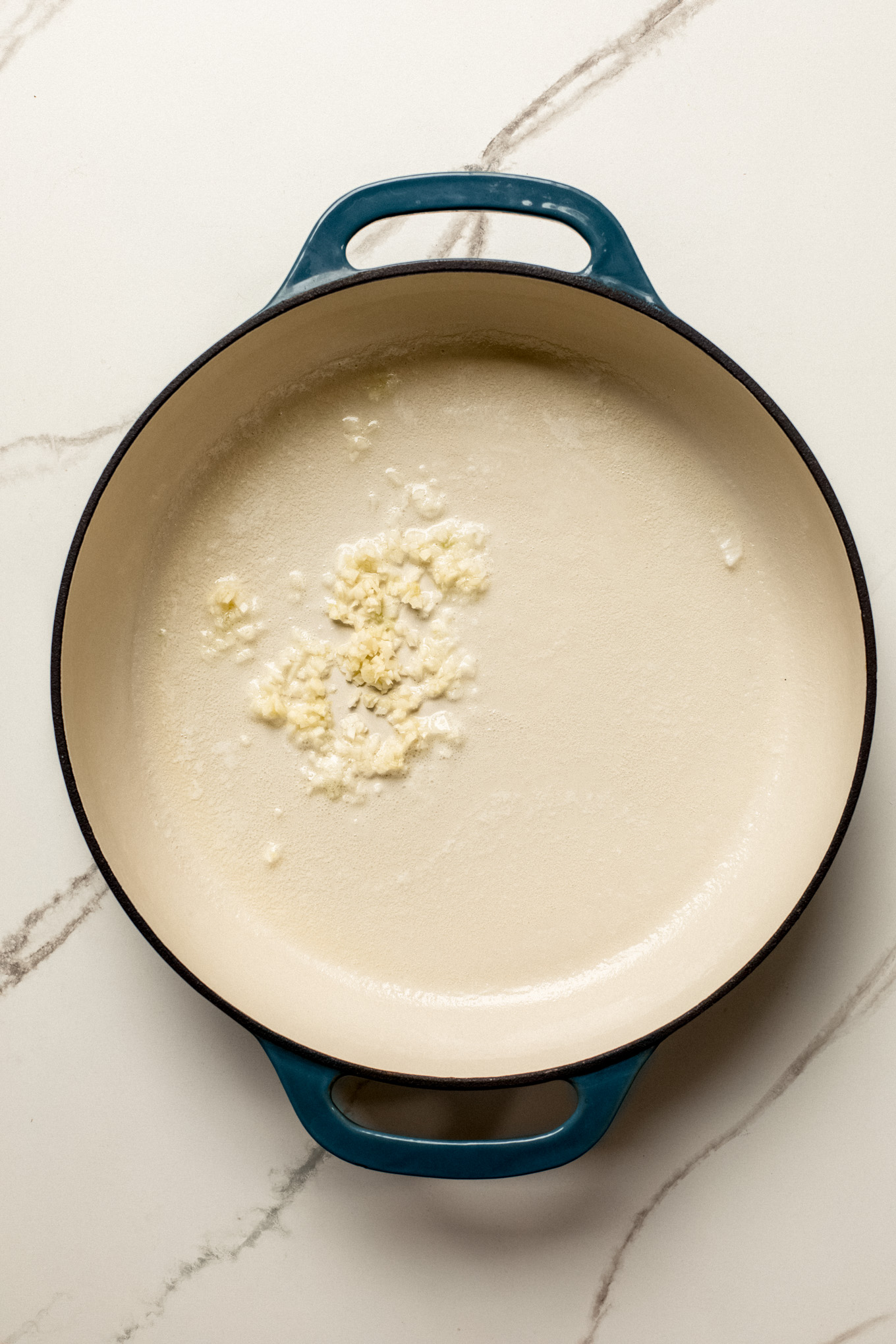 minced garlic in a skillet with butter.