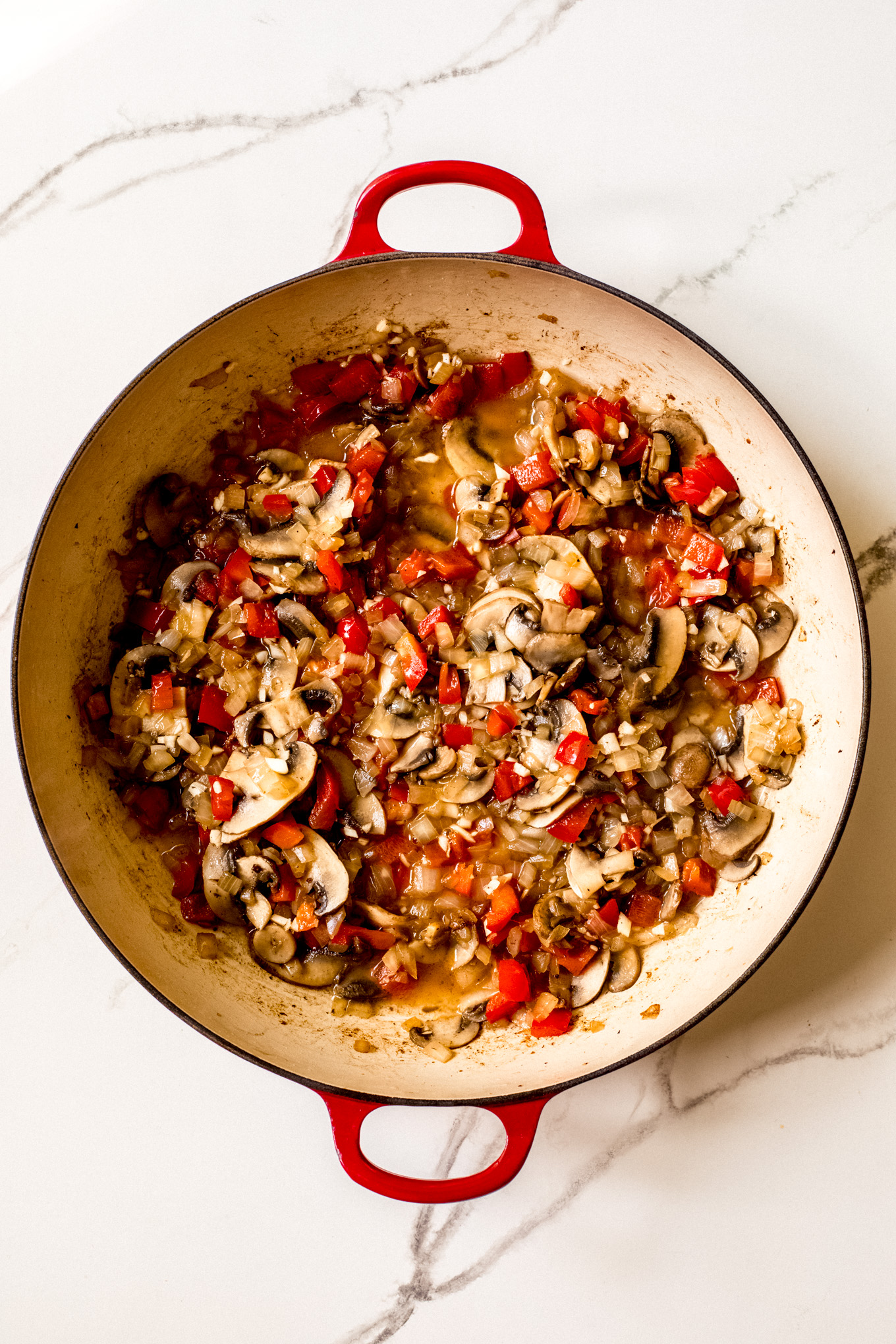 cooked vegetables in a saute pan.