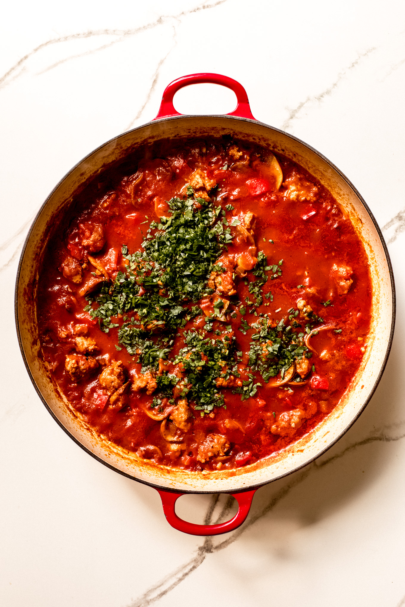 cooked sausage cacciatore sauce with fresh parsley.