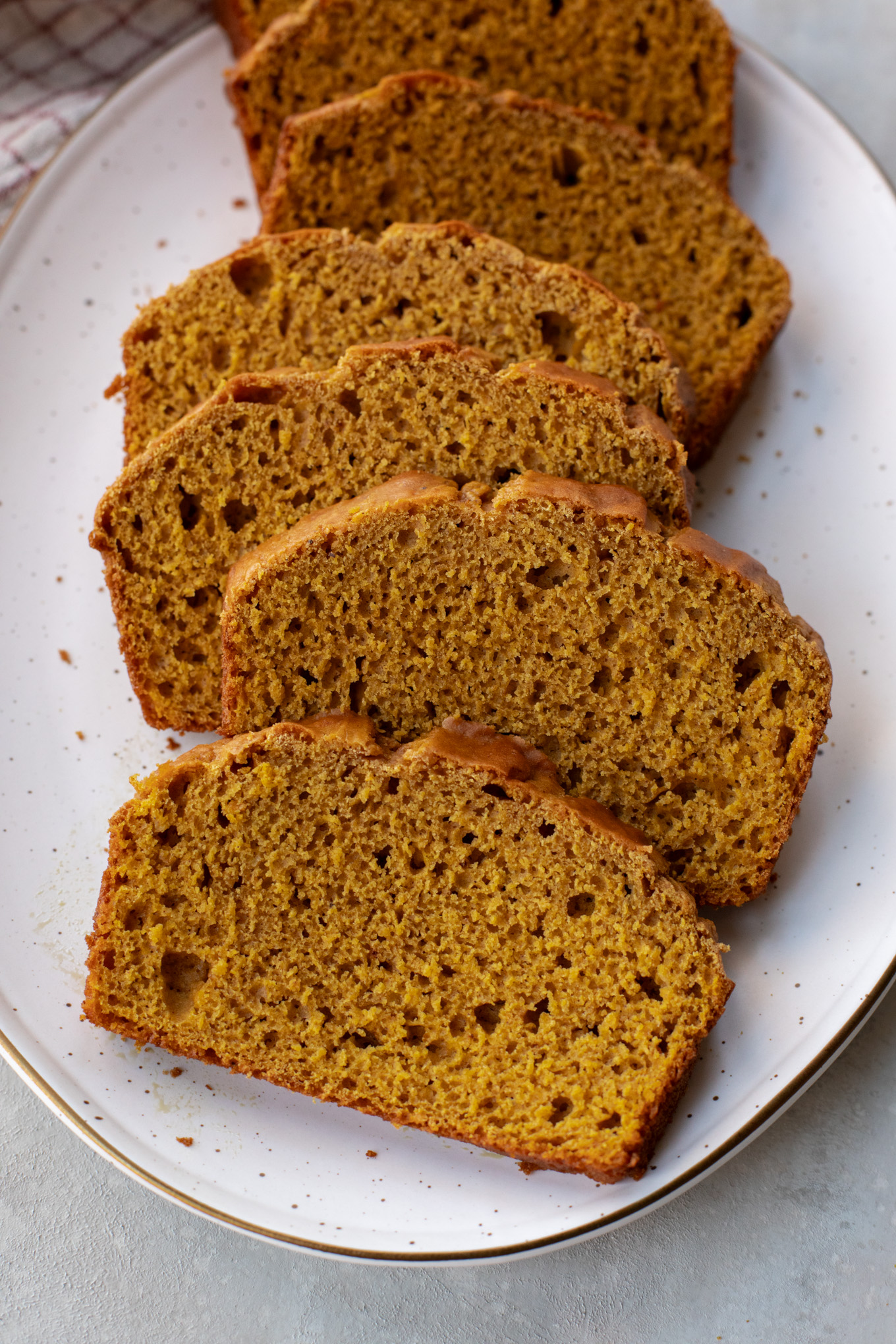 sliced pumpkin bread on a plate.