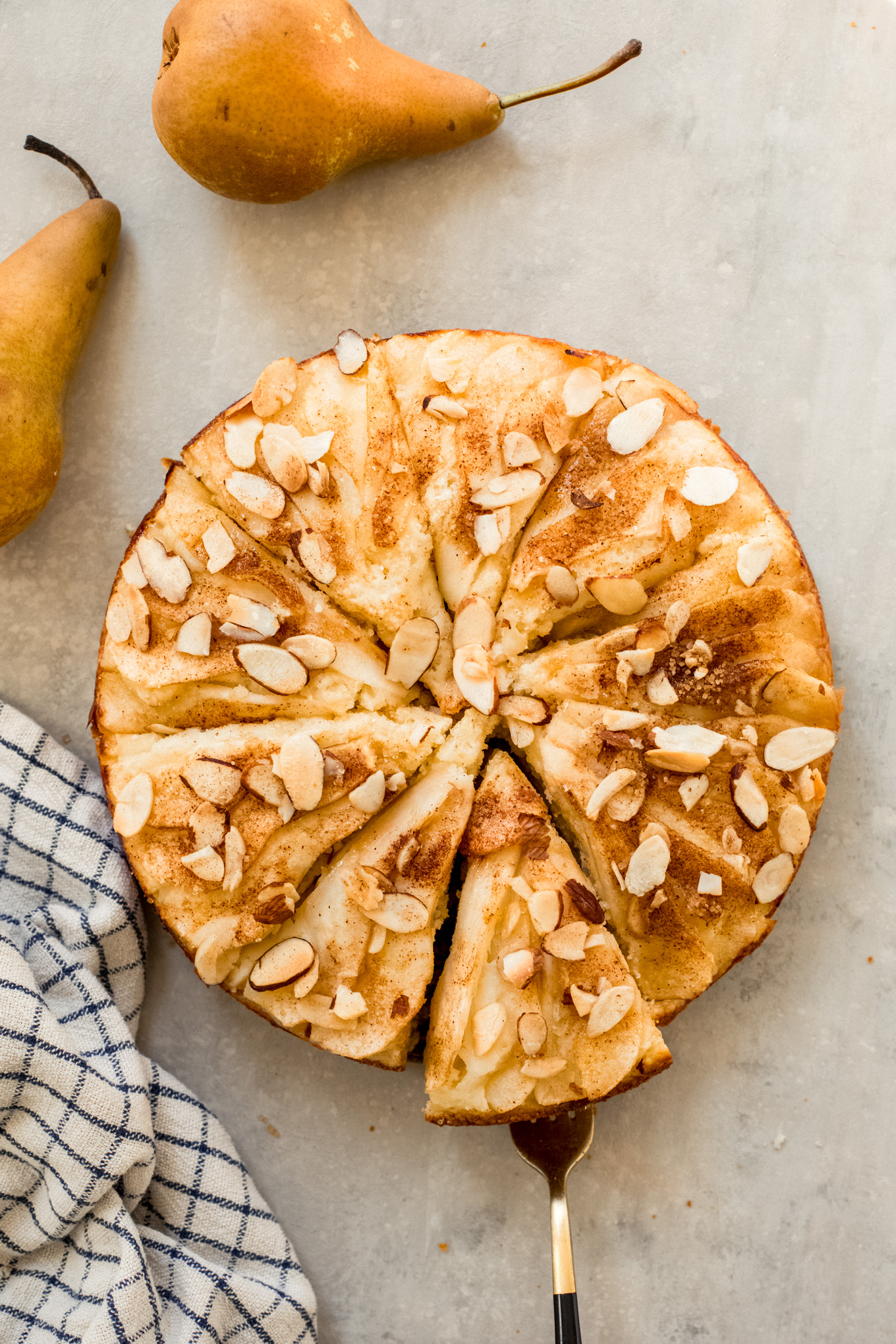 sliced pear cake with fresh pears.