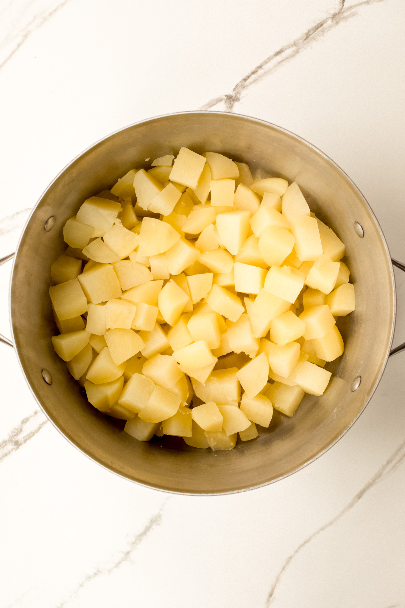 cooked and drained potatoes in a stockpot.