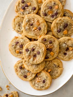 caramel toffee cookies on a white platter.