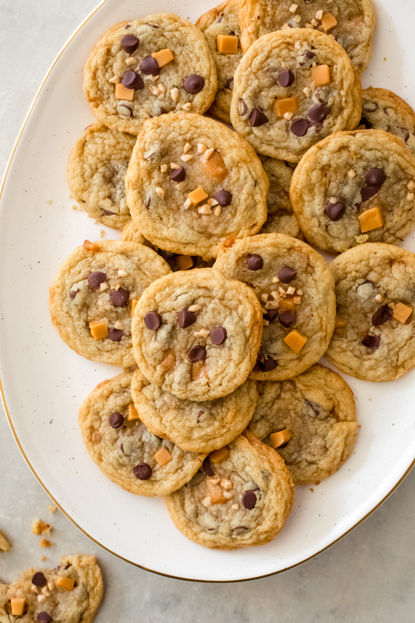 caramel toffee cookies on a white platter.