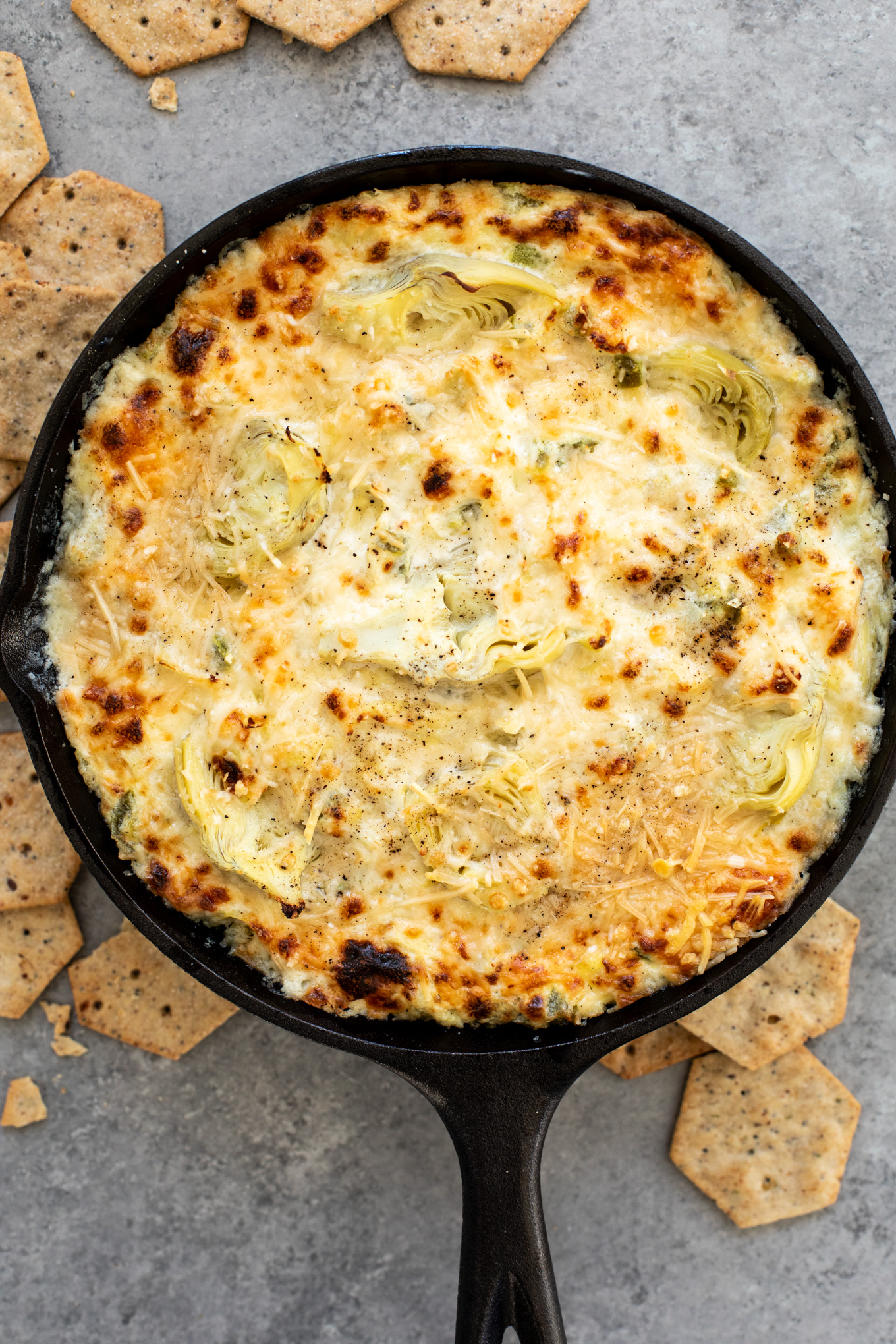 jalapeno artichoke dip in a cast iron.