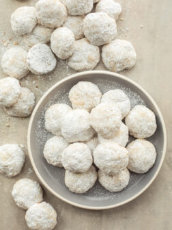 pecan ball cookies in a plate.