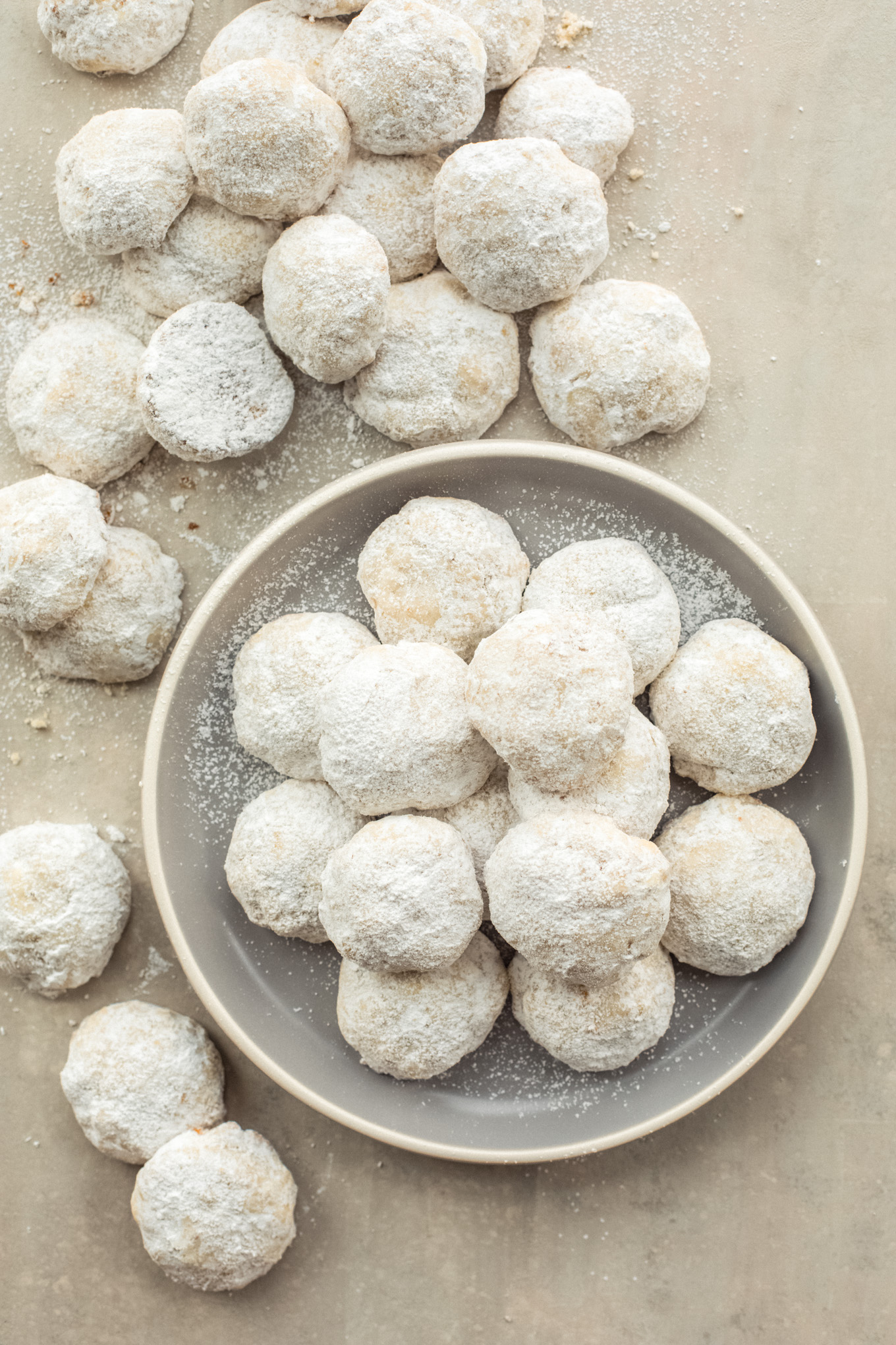 pecan ball cookies in a plate.