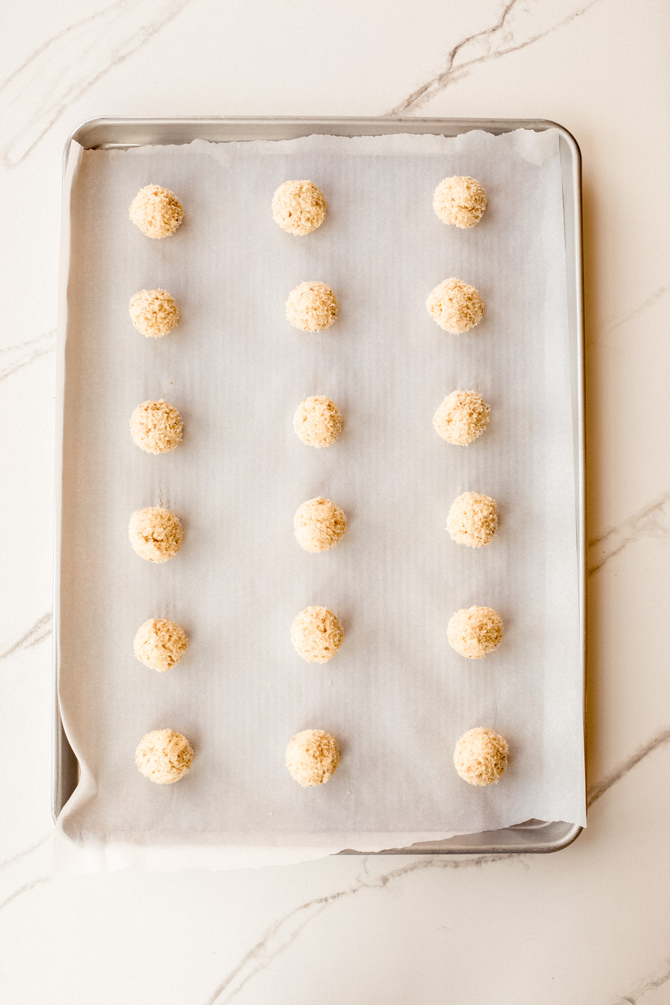 rolled cookie dough on a baking sheet.