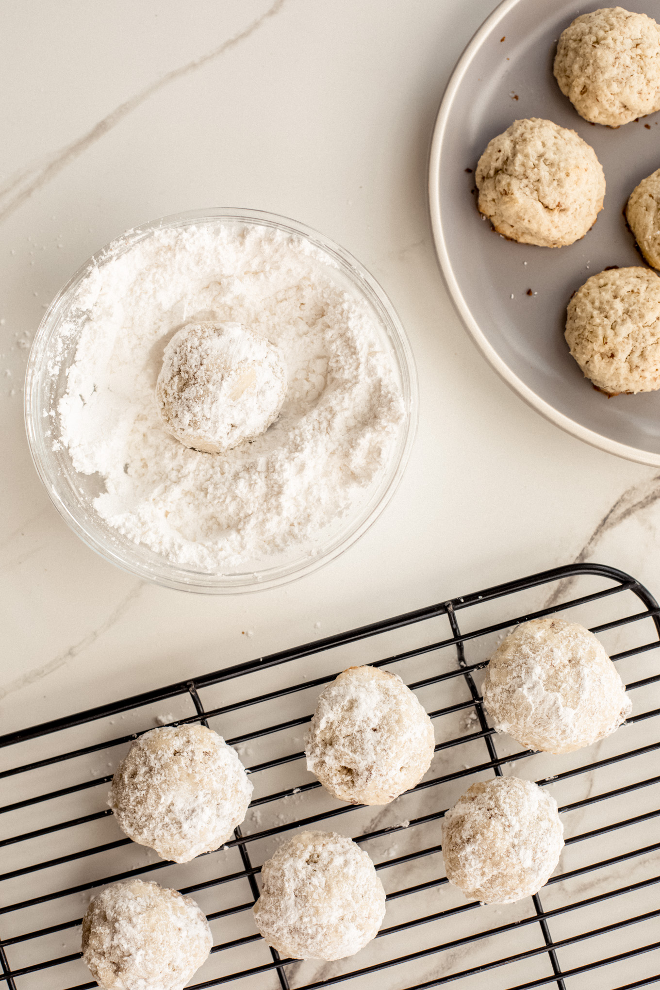 cookies dunked in confectioners' sugar.
